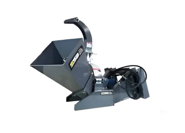 A gray wood chipper is sitting on the ground.