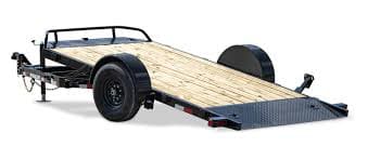 A trailer with wood planks on the back of it.